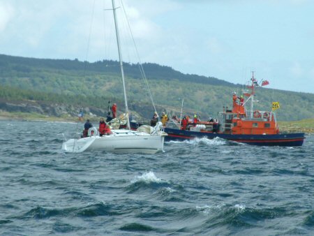 The committee boat in the background